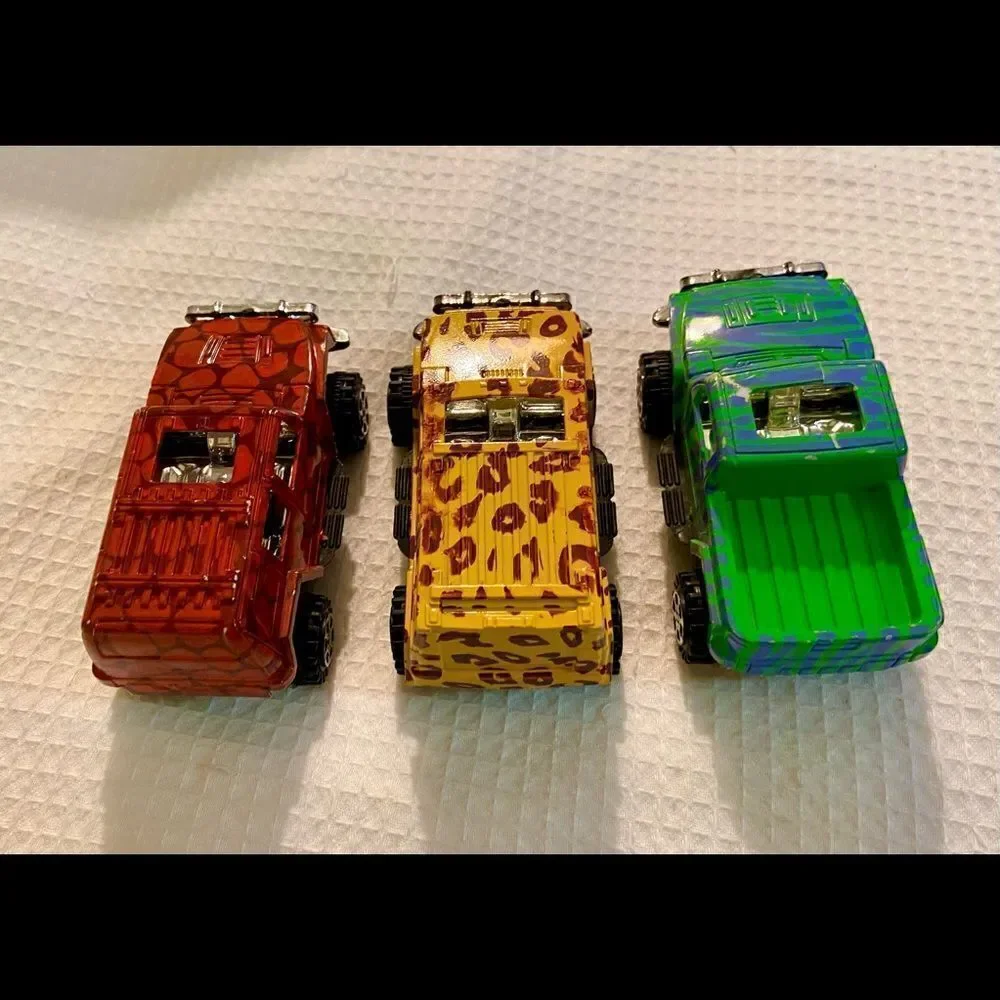 Vintage Lot Of 3 Toy 4 X 4 Trucks W Animal Prints Good Condition Unbranded.